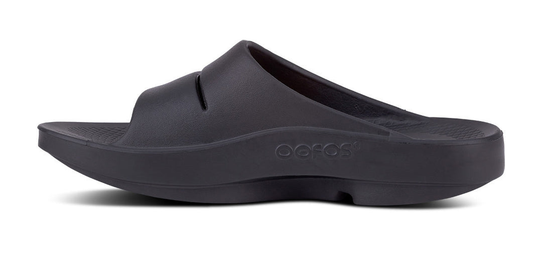 OOFOS OOahh unisex recovery slide in Black, medial view