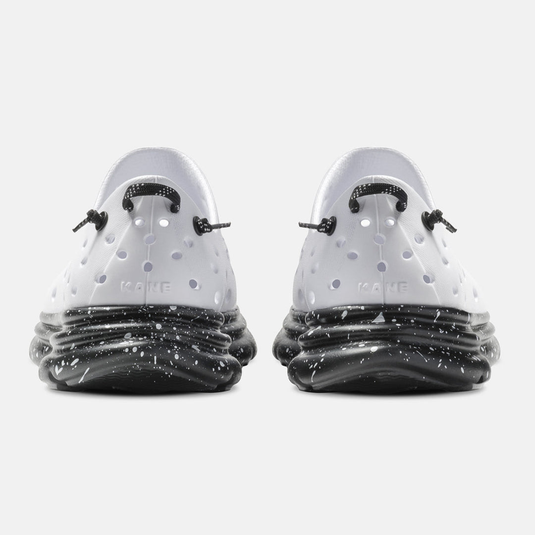 Kane Revive unisex recovery shoe in White / Black Speckle, back view